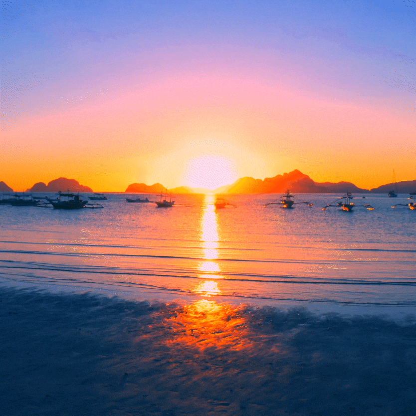 Animação pairando o oceano com barcos e um céu laranjado pelo sol